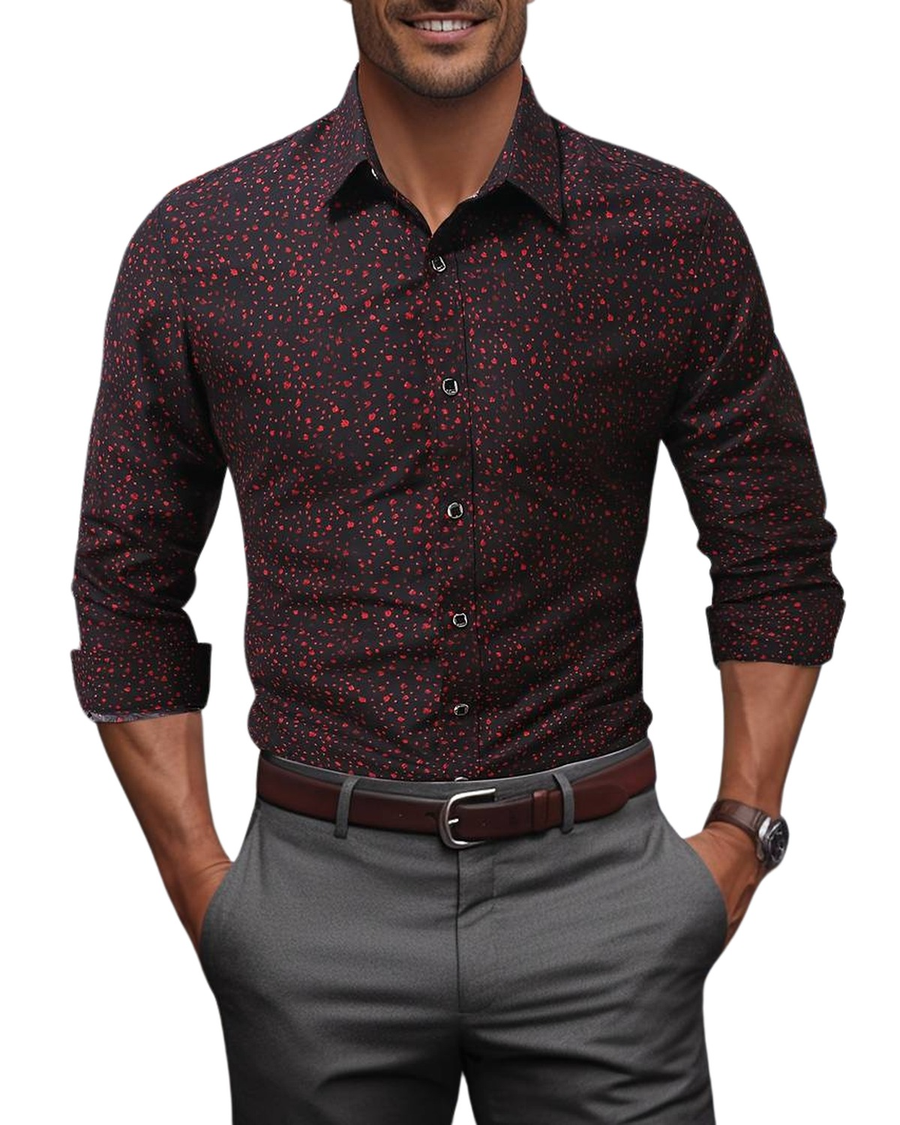 Burgundy printed shirt worn with grey trousers and brown belt
