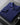 Dark blue cardigan folded, collar and zip close-up