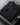 Black cardigan folded, collar and zip close-up